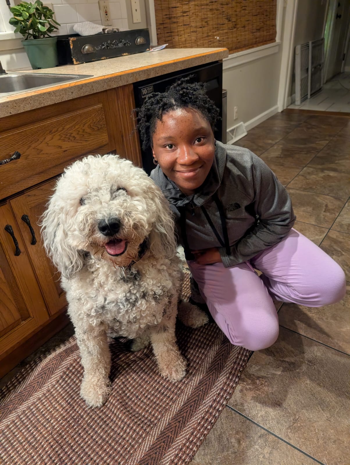 Girl sitting with dog